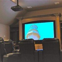 This quality theater was created on the top floor of a new home. The 120" screen drops down in front of the customers' 70" LED when they want to watch a blockbuster movie or big game!