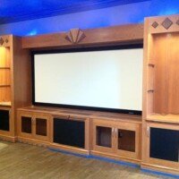 This outstanding home theater features products from KEF, Epson, Screen Innovations, Marantz, and Sunfire. The custom cabinet was built by Fine Wood Creations of Edmond.
