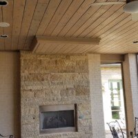 This patio has a large TV that drops down, so the homeowner can enjoy television outdoors...