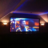 Wow! This theater system started out as a dusty attic and turned into a fun theater room, which features products from Epson, Screen Innovations, KEF, SI, Marantz. They have a full concession stand, fully equipped with drink dispensers up there too! Check out the custom lighting...