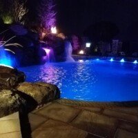 This was already a fantastic looking swimming pool, but notice how much the custom lighting adds!