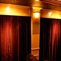 The custom built columns became quite useful, as we used them to house the side surround speakers. Check out the custom curtains too!